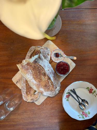 a table topped with bread and a plate of sauce at Maison avec Piscine - Vue exceptionnelle - Parisot in Parisot-Tarn-et-Garonne