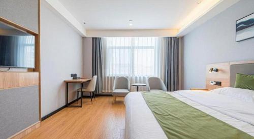 Ένα ή περισσότερα κρεβάτια σε δωμάτιο στο Green Tree Inn Anhui Tianchang Economic Development Zone