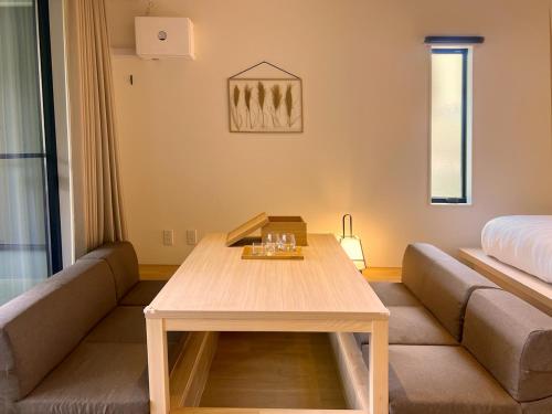 a living room with a couch and a table at Rakuten STAY Hakone Susuki Grass Fields in Sengokuhara