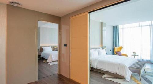 Katil atau katil-katil dalam bilik di Tomeet Hotel