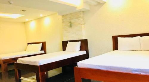 Katil atau katil-katil dalam bilik di Whale Ocean View Hotel