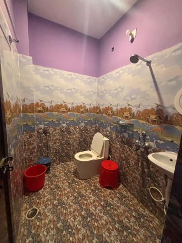 a bathroom with a toilet and a sink at Singh home stay in Bodh Gaya