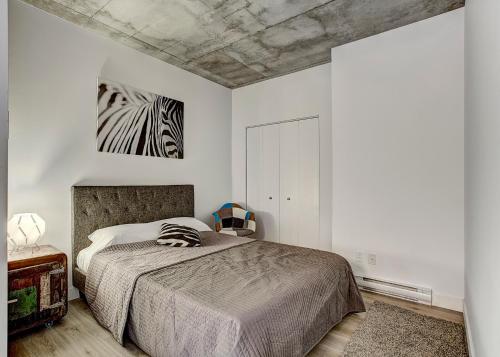 a bedroom with a bed and a painting on the ceiling at The Downtown Oasis in Montréal