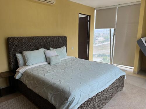 Postel nebo postele na pokoji v ubytování Condominio Paraiso