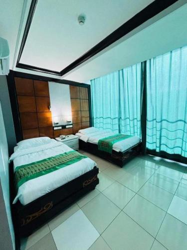Postel nebo postele na pokoji v ubytování Marcian Business Hotel