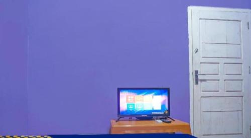 Hotel O Kost Qiu Qiu 99にあるテレビまたはエンターテインメントセンター