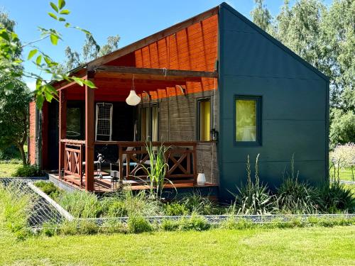 a tiny house with a large deck at Lazy Deer - Camp in Staniszów