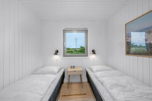 Ένα ή περισσότερα κρεβάτια σε δωμάτιο στο Lovely Holiday Home, Renovated In 2025, Located Only 800 Meters From The North Sea