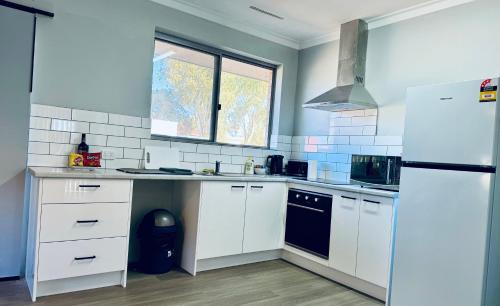Η κουζίνα ή μικρή κουζίνα στο 3 Bedroom House