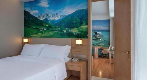 Кровать или кровати в номере Vienna Best Sleep International Hotel Shenzhen New Airport Branch