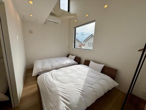 Katil atau katil-katil dalam bilik di Kinagashi Happo Chalet East