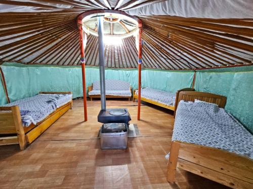 Postel nebo postele na pokoji v ubytování Bumbat Eco