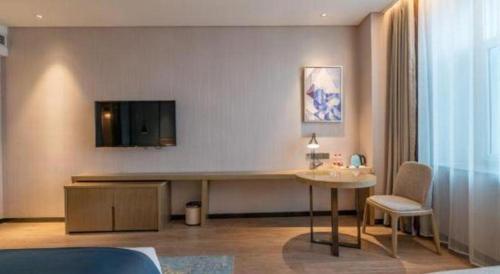 Μια τηλεόραση ή/και κέντρο ψυχαγωγίας στο Echarm Hotel Jinan Railway Station Daming Lake