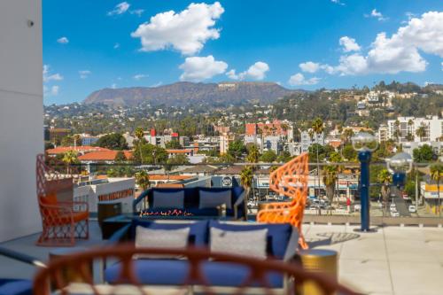 a view of a city from a balcony at One Lux Stay - Hollywood in Los Angeles