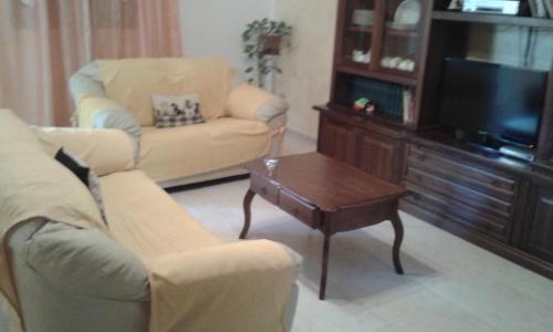 a living room with a couch and a coffee table at terra e mare in Collemeto