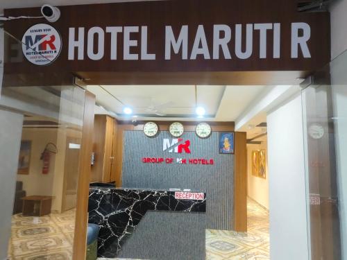 a hotel martini sign on the front of a building at Hotel MARUTI R Drive Inn Road in Ahmedabad