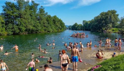 a large group of people swimming in a river at Apartmaji Vanja - 4 sobno in Gradac