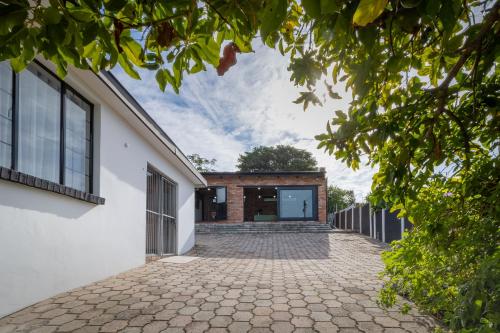an external view of a brick building with a driveway at Mount Rd Ocean View in Gqeberha