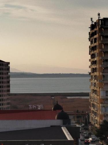 a view of the ocean from a city with buildings at Baku Artpatena Lake view in Baku