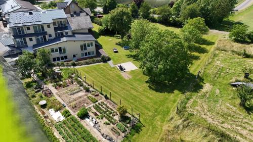 an aerial view of a house with a garden at Waldesblick, Hotel-Restaurant in Lahr
