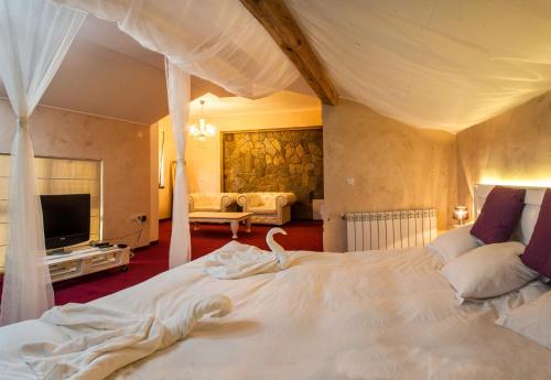 a bedroom with a large bed with a swan on it at Boriki Complex in Pamporovo