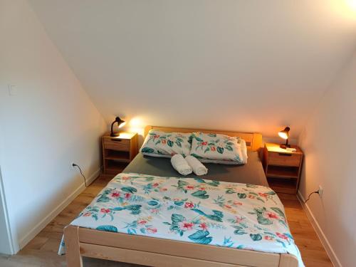 En eller flere senge i et værelse på Aura Roztocze