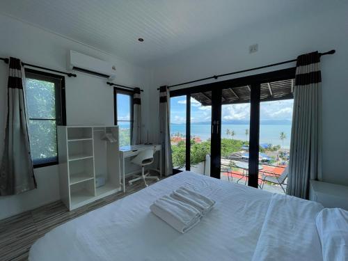 เตียงในห้องที่ Joy Houses