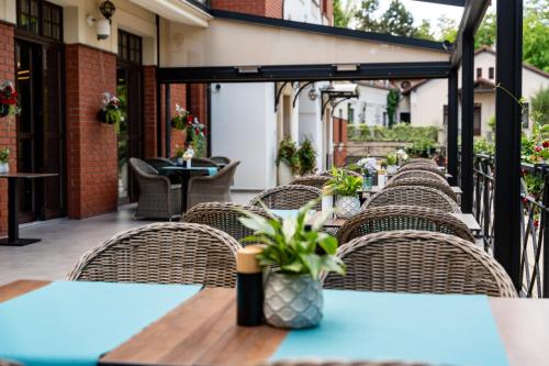 a row of tables and chairs on a patio at Grand Sal in Wieliczka