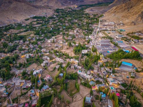 an aerial view of a village in the mountains at Hotel Bayshu - The Hosteller Leh in Leh