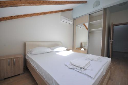 Postel nebo postele na pokoji v ubytování Adriatic Residence