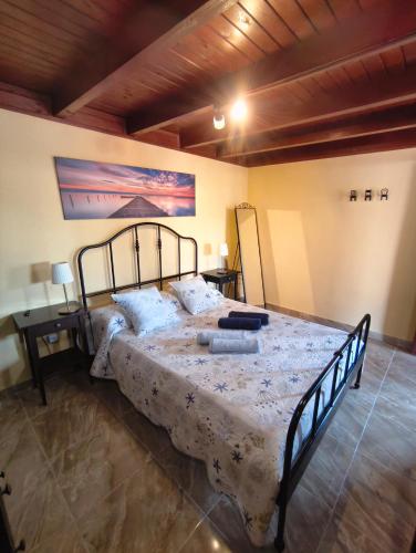 a bedroom with a large bed in a room at Casa Orymar in Cotillo