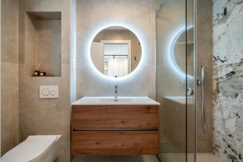 a bathroom with a sink and a mirror at Marevita in Podstrana