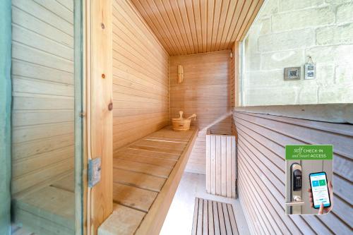a sauna with a pay phone in a room at Corte Dei Granai Meeting & SPA - Raro Rooms Collection in Maglie