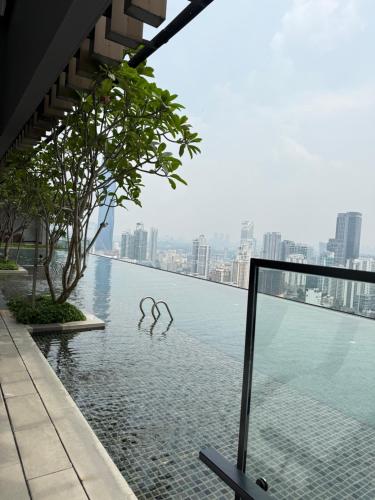 a pool of water with a view of a city at Axon Suite Bukit Bintang By Luna in Kuala Lumpur