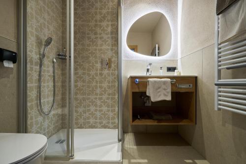 a bathroom with a shower and a sink at Hotel Stern in Ehrwald