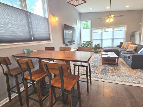 a living room with a wooden table and chairs at Close to everything downtown in Indianapolis