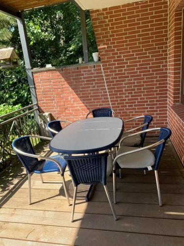 a table and chairs sitting on a patio at Ferienwohnung Wieben in Sankt Peter-Ording