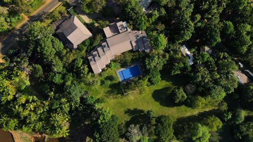 an overhead view of a house in the forest at Grand Tamarind Lake in Kataragama