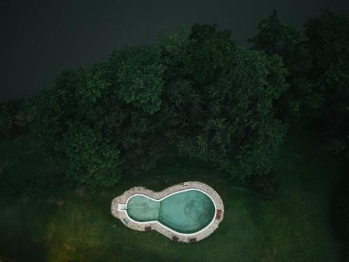 an aerial view of a lake in the middle of a forest at Chong khaep aingkwai resort Saiyok in Sai Yok