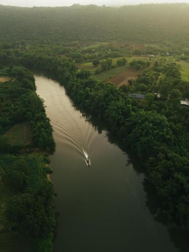 an aerial view of a river with a boat in it at Chong khaep aingkwai resort Saiyok in Sai Yok