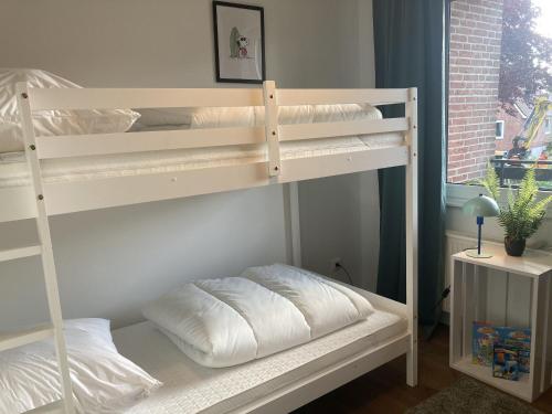 Postel nebo postele na pokoji v ubytování Stranddistel 4