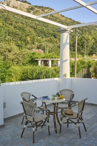 a table and chairs on a patio with a view at Casa Nannina in Anacapri