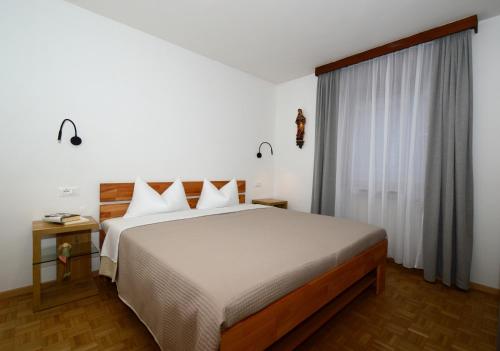 Postel nebo postele na pokoji v ubytování Residence Albierch
