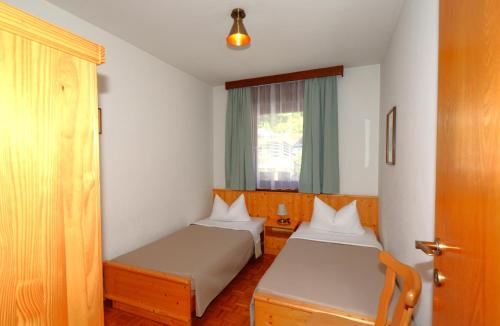 Postel nebo postele na pokoji v ubytování Residence Albierch
