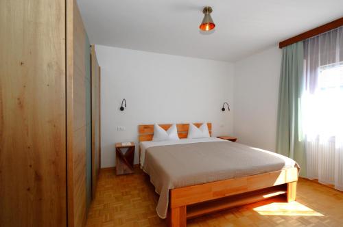 Postel nebo postele na pokoji v ubytování Residence Albierch