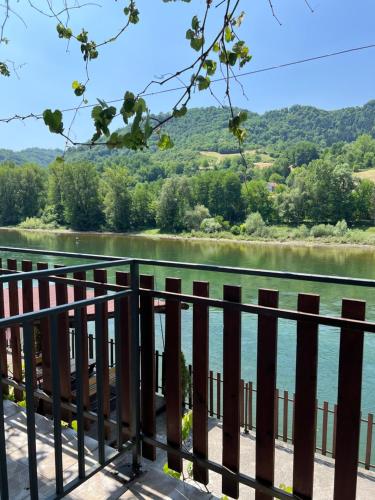 a view of a river from a fence at Vila Zelenika Drina 