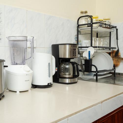 a kitchen counter with several appliances on it at House of Sincerity in Maharagama