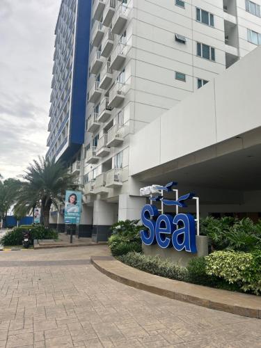 a sea sign in front of a building at Sea Residences MOA-Eric Apartments in Manila