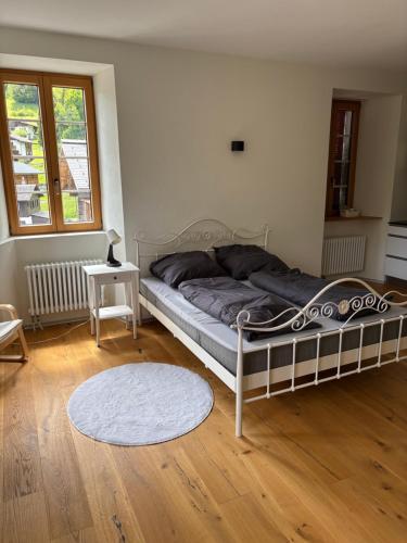 Postel nebo postele na pokoji v ubytování Hotel des Alpes