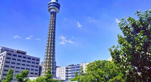 a tall tower in the middle of a city at Yokohama Royal Park Hotel in Yokohama